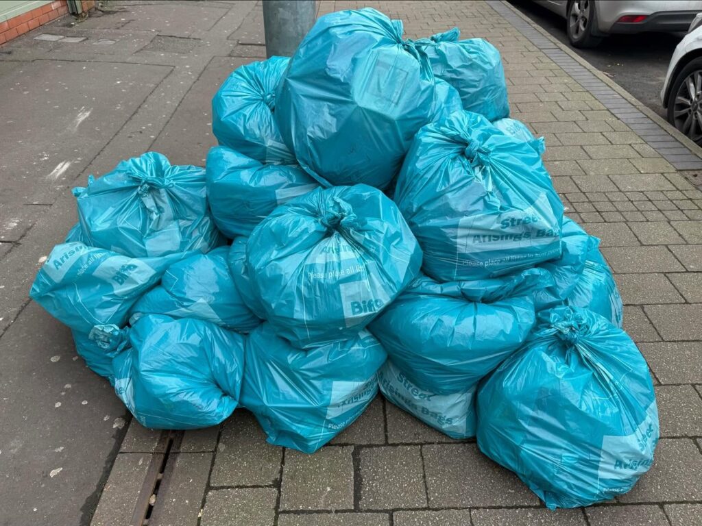Photo of large pile of rubbish bags